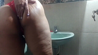 Hot MILF masturbates in the boss's bathroom with her dildo and moans with pleasure