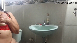 Hot MILF masturbates in the boss's bathroom with her dildo and moans with pleasure