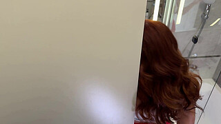 Hottest redhead real MILF wife with the shortest skirt and tan color fishnet stockings in the bathroom