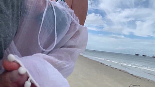 A stranger milf gives me a handjob in front of everyone.