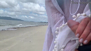 A stranger milf gives me a handjob in front of everyone.