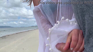 A stranger milf gives me a handjob in front of everyone.