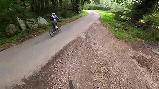 I see a girl cycling in the woods and when I go to urinate she helps me by giving me a blowjob in public