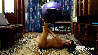 Naked, amateur hottie is doing training with an exercise ball
