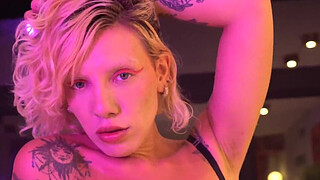 Busty blonde gives a blowjob and handjob backstage