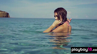 Skinny naked teen Katrina Pirs reveals her sweaty sun kissed pussy at beach