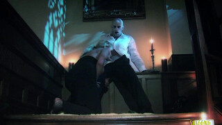 As the blonde milf gets up the stairs her big tits get grabbed by the vampire