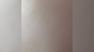 Hot sexy skinny and horny brunette babe plays with a dick under the quilt and puts oil on it