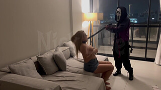 A masked stranger ties me up by the neck and makes me suck on her strap-on.