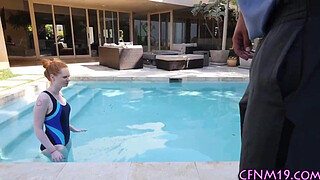 Clothed redhead takes cum