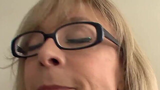 Big boobed blonde milf in stockings and a garter