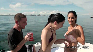 Sexy babes in bikinis partying on a boat