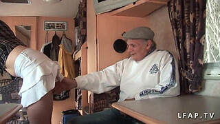 Serious redhead whore double penetrated in a gangbang with an old man