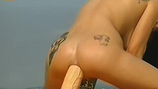 O'Pearl by the pool with a BIG dildo in her ass.