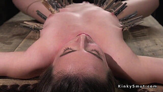 Brunette bound in device pussy caned