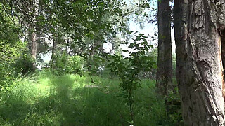 Voyeur outdoors peeps at two naked lesbians. Nudists with big asses sunbathe and enjoy nature and masturbation.