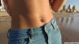 Wet shoot on a public beach with Crazy Model. Risky outdoor masturbation. Foot fetish. Pee in jeans.