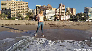 Wet shoot on a public beach with Crazy Model. Risky outdoor masturbation. Foot fetish. Pee in jeans.