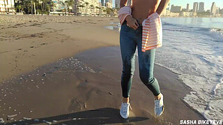 Wet shoot on a public beach with Crazy Model. Risky outdoor masturbation. Foot fetish. Pee in jeans.