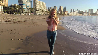 Wet shoot on a public beach with Crazy Model. Risky outdoor masturbation. Foot fetish. Pee in jeans.