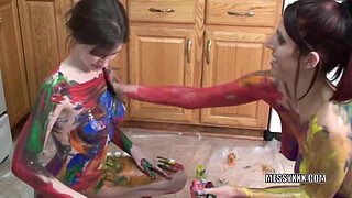 Tattooed redheads Indigo and Lavender get erotic with paint