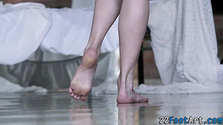 Kinky babe gives footjob
