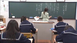 Japanese teacher gives a valuable lesson at the blackboard