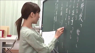 Japanese teacher gives a valuable lesson at the blackboard