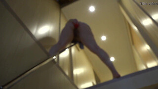 Anal masturbation with different sex toys to a bright orgasm, a brunette with a juicy ass in a short skirt has fun on the stairs.