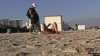 Exhibitionist Wife 24 - My friend Anjelica BIG TIT AND SHAVED PUSSY FLASHING a voyeur at a public beach while chatting with hubby on the phone!