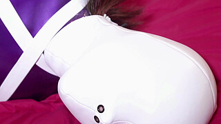 Sexy girl hooded, locked into a armbinder teased by a vibrator in her pussy
