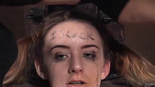Femdom rubs pussyjuice on suspended teen