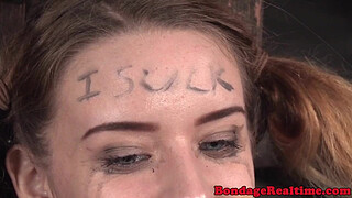 Femdom rubs pussyjuice on suspended teen