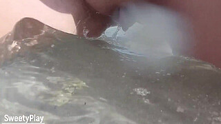 Shaved pussy peeing on public beach