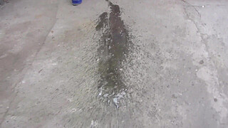 MILF pee in tight pants in a public park open air. Dirty cunt squatting pissing in the yard.