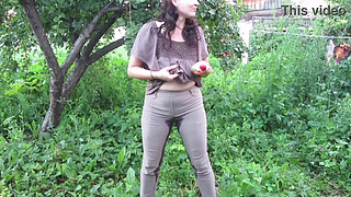 MILF pee in tight pants in a public park open air. Dirty cunt squatting pissing in the yard.