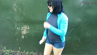 Cunt pissed with a powerful stream behind public garages. Brunette loves to pee outdoors.