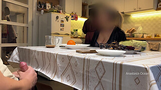 My husband jerking under a table front of my step mom and i right at the kitchen.
