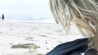 Filming an anal scene on the beach in front of passersby