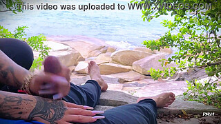 Surprise ejaculation handjob on the beach