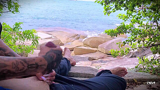 Surprise ejaculation handjob on the beach