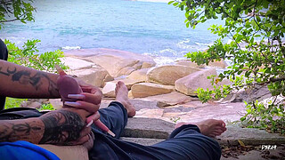 Surprise ejaculation handjob on the beach