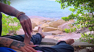 Surprise ejaculation handjob on the beach