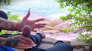 Surprise ejaculation handjob on the beach
