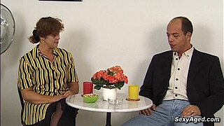 Busty amateur German mature lady Beatta jerking big cock to balding guy Gustavo Meunier while he toying her hairy pussy then he fucks her