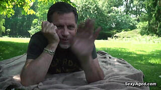 Voyeur old man Philippe Soine watching sexy blonde babe Angela Vidal enjoying on the blanket in the public park and soon after he fucking her