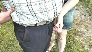 Random man pees. My slut wife saw random man on street who wanted to pee. Wife came up to him, unzipped pants and held his peeing dick in fingers. Naked men dressed women. Public. Outdoor. Outside. MILF. Beauty. Short skirt. Handjob. Fingering. In public