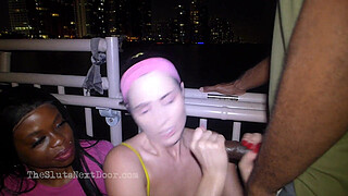 Double handjob on public beach