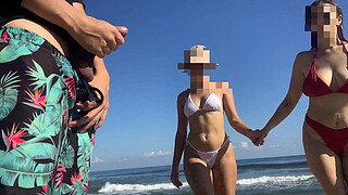 Exhibitionist voyeur flashes dick on public beach in front of two horny girls
