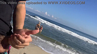 Exhibitionist voyeur flashes dick on public beach in front of two horny girls